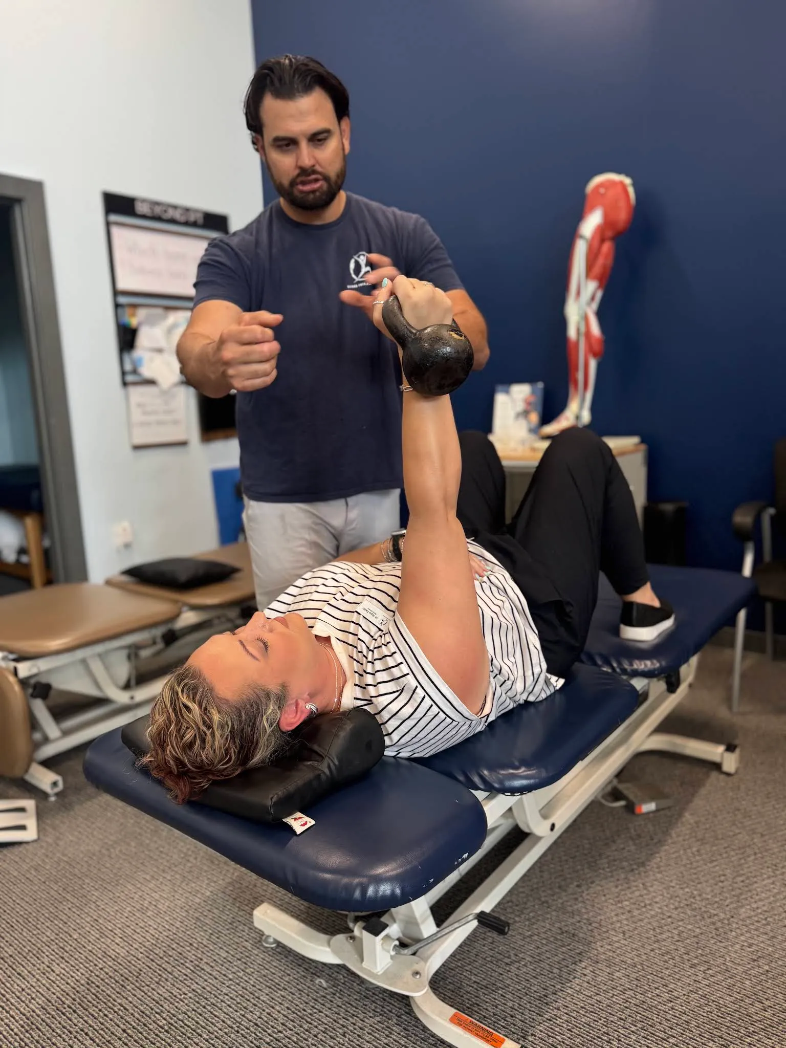 A Beyond Physical Therapy clinician guiding a patient through one-on-one treatment.
